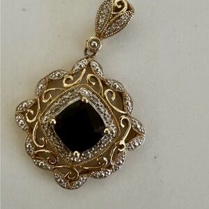 2.2ct tw Garnet and diamond accent pendant in 14k gold
